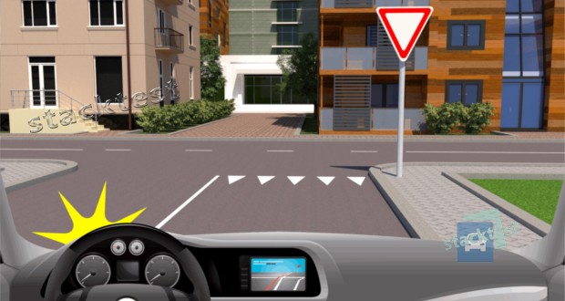 В каком месте Вы должны остановиться, чтобы уступить дорогу транспортным средствам на пересекаемой дороге, поворачивая налево в данной ситуации?