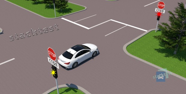 Как должен поступить водитель белого автомобиля, выехавший на пересечение проезжих частей на зеленый сигнал светофора?